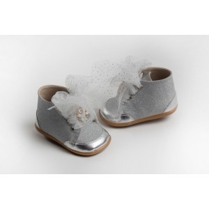 Baby girl first steps boot shoes made of leather and glitter textile, decorated with strass button