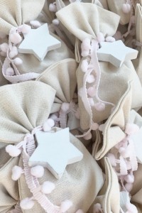 Christening favor for girl ivory pouch with wooden star