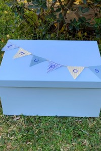 Christening box  for boy with the  name of the baby in little flags