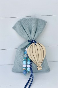 Christening favor for boy, pouch with hot-air balloon and beads
