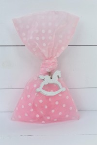 Christening favor for girl pink polka dot pouch with wooden horse