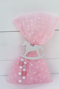 Christening favor for girl, pink polka dot pouch rith wooden horse and beads