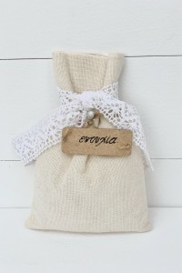 Wedding favor pouch with wood label and traditional lace