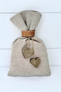 Wedding favor pouch with wood hearts